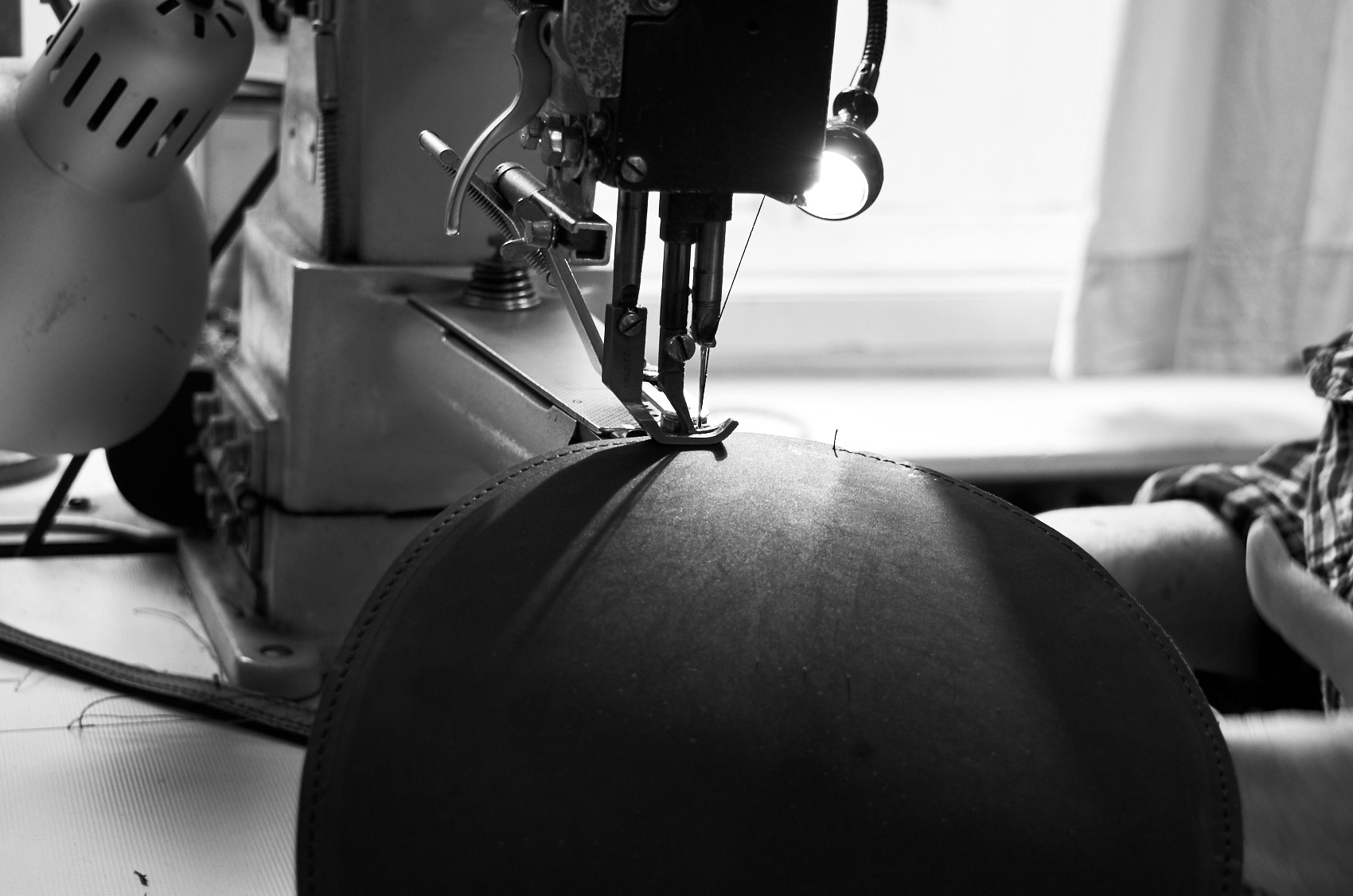 Woman working at cylinder arm sewing machine stitches Olbrish handbag Charlie